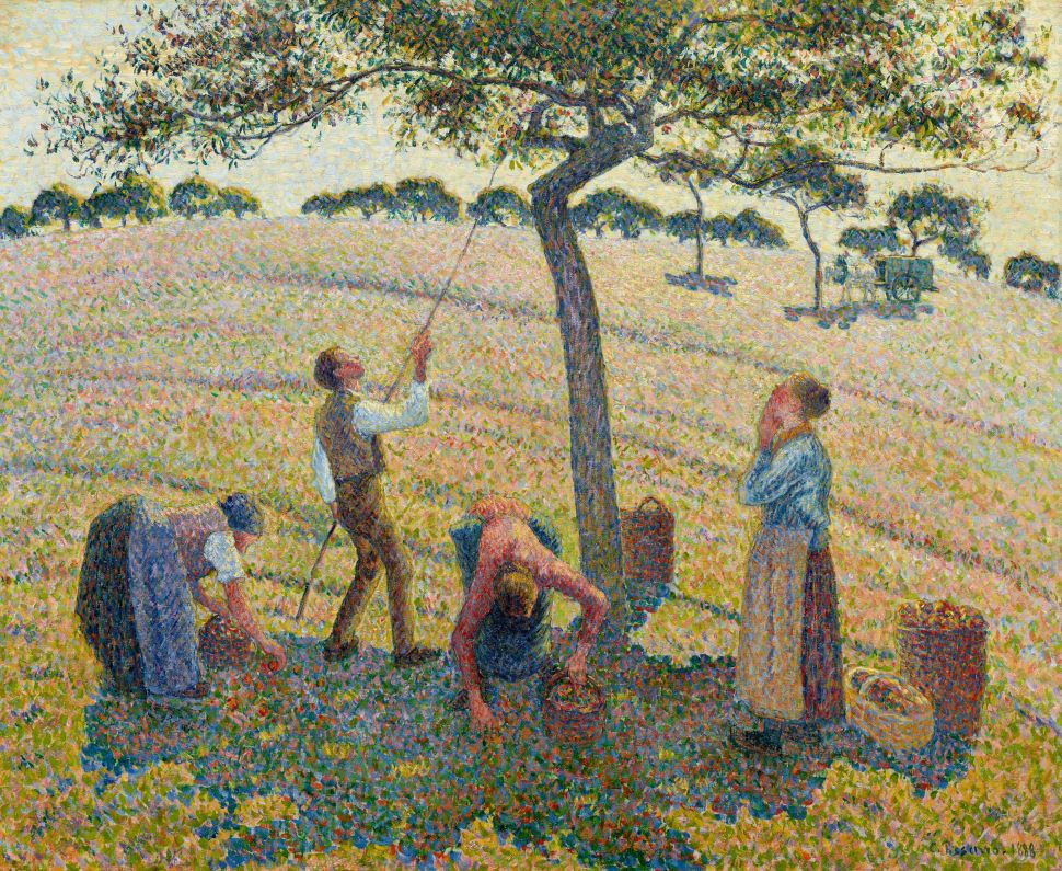 A pointillist painting shows four farm workers gathering fruit beneath a tree in a brightly dappled orchard with rolling fields and a horse-drawn cart in the distance.