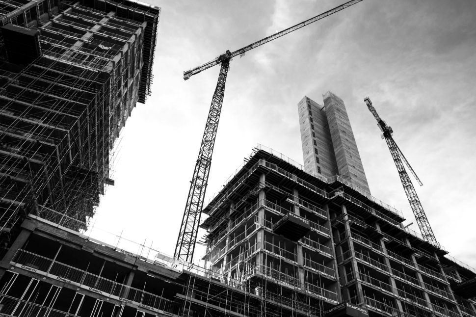 A building under construction, with its foundation visible