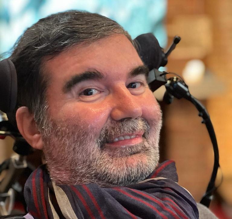 A While man in a wheelchair